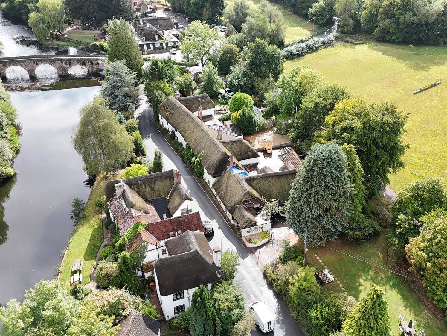 Historic Riverside Thatched Inn Reimagined as a Private Retreat